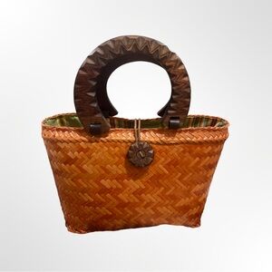 Orang straw bag with Woden handle and snap elastic on widen button. Used